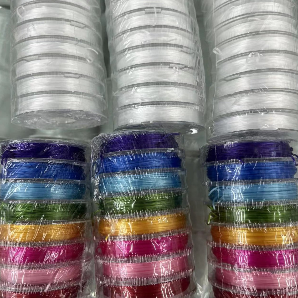 White and colorful stretch strings smaller rolls, sold by 10 small rolls